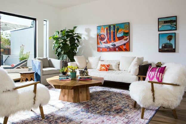 Photo of an eclectic living room illustrating summer home décor trends for 2023.