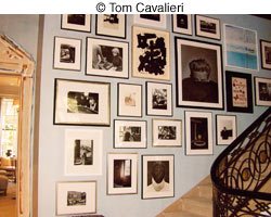 hanging photos by staircase